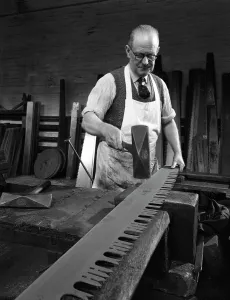 Steelworker Prints: Tensioning the crosscut on a two metre saw blade, Sheffield, South Yorkshire, 1963