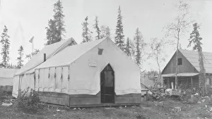 Log Building Prints: Tent next to log cabin, between c1900 and 1916. Creator: Unknown