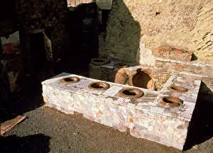 Termopolio ruins, hot food shop, located on Cardo V street, located on the ruins of Herculaneum Termopolio ruins, hot food shop, located on Cardo V street, located on the ruins of Herculaneum