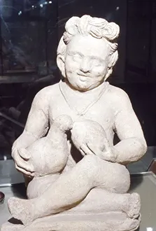 Votive Prints: Terracotta Etruscan Votive of Child Feeding Bird, from Vulci, c2nd century BC
