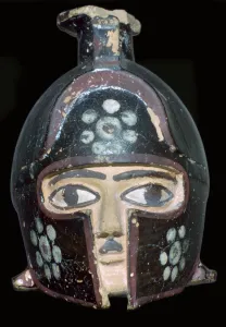 Terracotta scent-bottle in the shape of a helmeted head, Rhodes, Greece, c600-550BC Terracotta scent-bottle in the shape of a helmeted head, Rhodes, Greece, c600-550BC