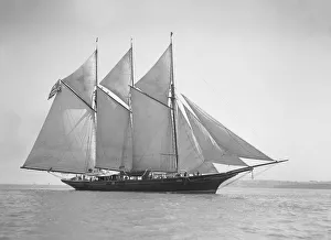 The three-mast auxiliary schooner Invincible, 1911. Creator: Kirk & Sons of Cowes