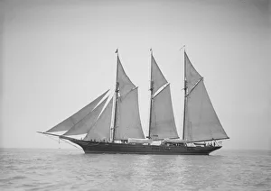 The three-mast auxiliary schooner Invincible, 1911. Creator: Kirk & Sons of Cowes