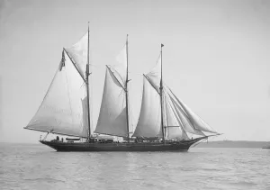 The three-mast auxiliary schooner Invincible, 1911. Creator: Kirk & Sons of Cowes