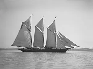 The three-mast auxiliary schooner Invincible, 1911. Creator: Kirk & Sons of Cowes