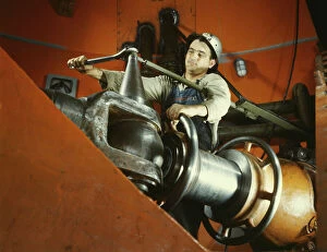 Engine Gallery: Tightening a nut on a guide vane operating seromotor in TVA s... Watts Bar Dam, Tennessee, 1942