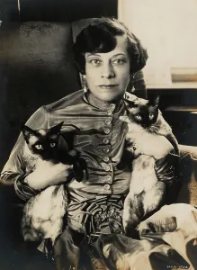 Durieux Prints: Tilla Durieux with two Siamese cats, 1920s. Creator: Stone, Sasha (1895-1940)