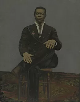 Portraits Gallery: Tintype of a man wearing a suit with a pendant on the lapel, early 20th century