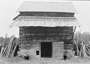 Sharecropper Gallery: Tobacco barn with front shelter, Olive Hill, North Carolina, 1939. Creator: Dorothea Lange