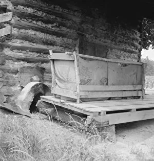 Timber Gallery: Tobacco barn with tobacco sled and vehicle used... Person County, North Carolina, 1939