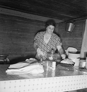 Bucket Collection: Tobacco sharecroppers wife cleaning up table after washing... Person County, North Carolina, 1939