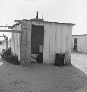 Toilet for ten cabins, men, women, and children, Arkansawyers auto camp, Greenfield, CA, 1939. Creator: Dorothea Lange