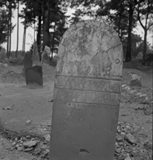 Graves Collection: Tombstone in a red clay Negro cemetery, Person County, North Carolina, 1939. Creator: Dorothea Lange