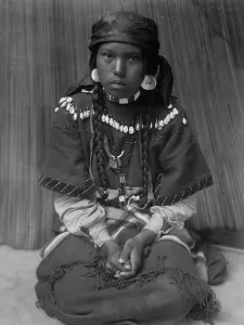 Shells Prints: Touch her dress-Kalispel, c1910. Creator: Edward Sheriff Curtis
