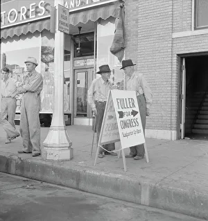 Cowboy Hat Prints: On the town square, Fayetteville, Arkansas, 1938. Creator: Dorothea Lange