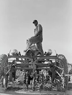 Bib Overalls Collection: Tractor on Lake Dick project, Arkansas, 1938. Creator: Dorothea Lange