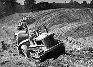 Rotherham Prints: Tractor unit pulling an earth grading machine at a site near Rotherham