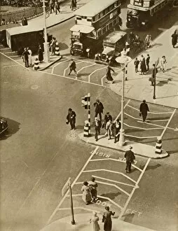 Traffic and pedestrians in Trafalgar Square, London, 1935. Creator: Unknown