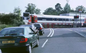 Traffic queue at level crossing in Brockenhurst, Hampshire