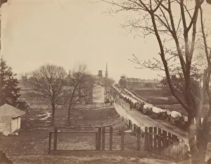 Waggon Prints: Train of Army Wagons Entering Petersburg, Virginia, April 1865. Creator: John Reekie
