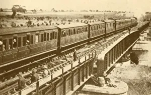 Golding Prints: A Train Passing Over The Bridge, c1930. Creator: Unknown
