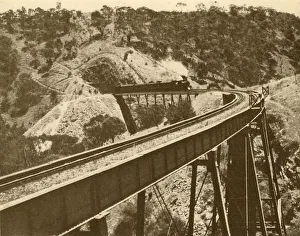 Express Train Prints: Train Passing Over Viaduct, Mount Lofty Range, South Australia, 1930. Creator: Unknown