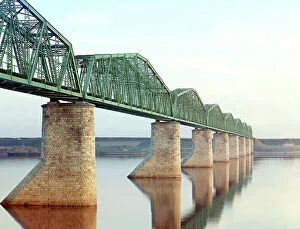 Civil Engineering Collection: Trans-Siberian Railway metal truss bridge on stone piers, over the Kama River near Perm..., c1910