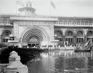 Transportation exhibit building with canal boat and ducks on canal(?) in foreground... 1893. Creator: Frances Benjamin Johnston