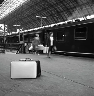 Suitcase Prints: Travellers on a platform, Centraal Station, Amsterdam, Netherlands, 1963. Artist