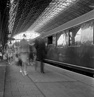 Travellers walking along a platform at Centraal Station, Amsterdam, Netherlands, 1963