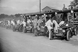 Boy Scout Gallery: Triumph and Riley cars in the pits at the RAC TT Race, Ards Circuit, Belfast, 1929 Artist