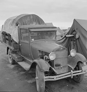 Trucks Collection: Truck, baby parked on front seat, FSA camp, Merrill, Klamath County, Oregon, 1939