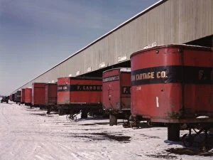 Truck trailers line up at a freight house to load and unload goods...C & NW RR, Chicago, Ill. 1942