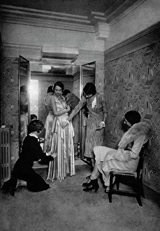 Trying on a dress at a great dressmakers, Paris, 1931. Artist: Ernest Flammarion