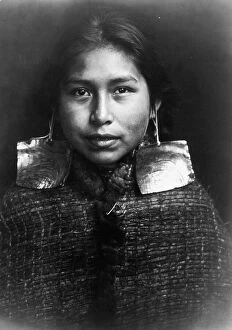 Earring Collection: Tsawatenok girl, head-and-shoulders portrait, facing front, c1914. Creator: Edward Sheriff Curtis