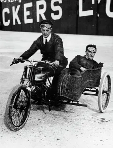 Sidecar Prints: Tudor and Thompson riding a motorcycle and sidecar