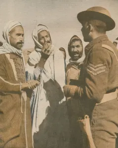 War Illustrated Prints: Tunisian Arabs Welcome a British Sergeant at Chaouach, 1943