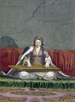 Turkish girl playing a keyboard plucking instrument, pub. 1707-08 Turkish girl playing a keyboard plucking instrument, pub. 1707-08