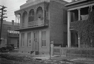Balcony Rail Prints: Two-story houses, New Orleans, between 1920 and 1926. Creator: Arnold Genthe