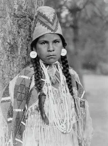 Shells Prints: Umatilla maiden, c1910. Creator: Edward Sheriff Curtis