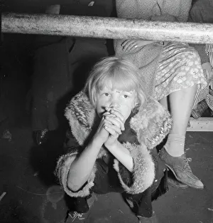 Second Hand Prints: Undernourished cotton picker's child listening to speeches of organizer