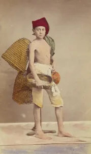 Water Pitcher Prints: Unidentified boy wearing native costume with baskets on back and carrying a water jug