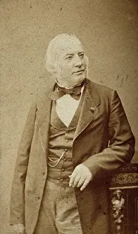 An unidentified man leaning on a cabinet, c1880s. Creator: Frederick Mulnier