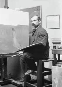 Unidentified man, seated at his easel, portrait photograph, between 1896 and 1942. Creator: Arnold Genthe