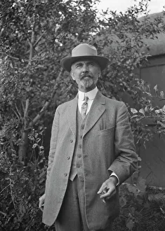 Eton Collar Prints: Unidentified man, standing outdoors, between 1896 and 1942. Creator: Arnold Genthe