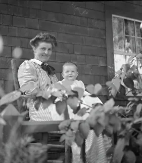 Group Portraits Prints: Unidentified woman and baby, seated on porch