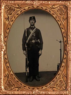 Standing To Attention Gallery: [Union Soldier Holding Rifle, with Photographers Posing Stand], 1861-65