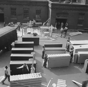 Carpentry Prints: United States government workers and carpenters making crates for steel