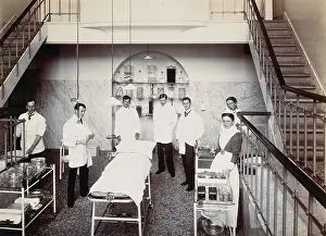Employee Prints: University College Hospital: medical staff in an operating theatre