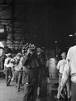 Banana Prints: Unloading bananas, New Orleans, between 1920 and 1926. Creator: Arnold Genthe